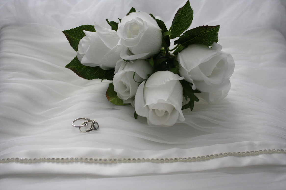Wedding Rings and White Roses